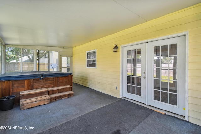 view of patio / terrace featuring french doors and a hot tub