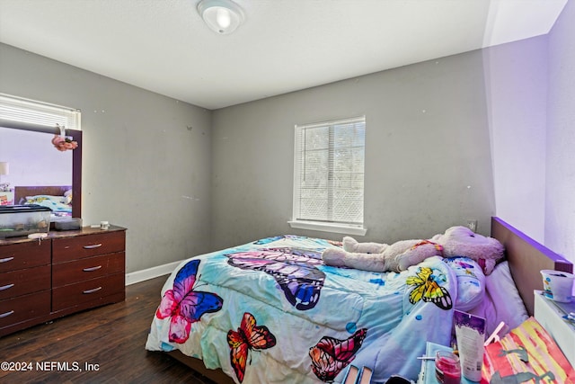 bedroom featuring dark hardwood / wood-style flooring