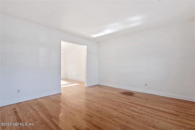 unfurnished room featuring light hardwood / wood-style floors