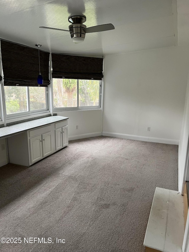 2305 Locustwood Ct, Orange Park, FL 32065 - spare room with a ceiling fan and carpet