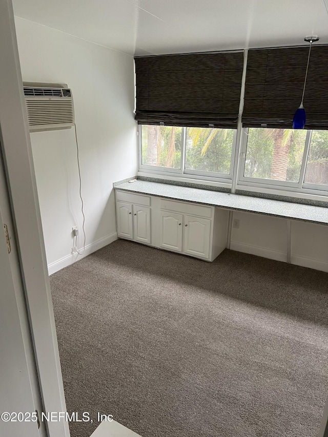 2305 Locustwood Ct, Orange Park, FL 32065 - unfurnished bedroom featuring carpet flooring, an AC wall unit, and an office area