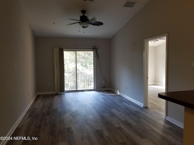 spare room featuring ceiling fan and dark hardwood / wood-style flooring