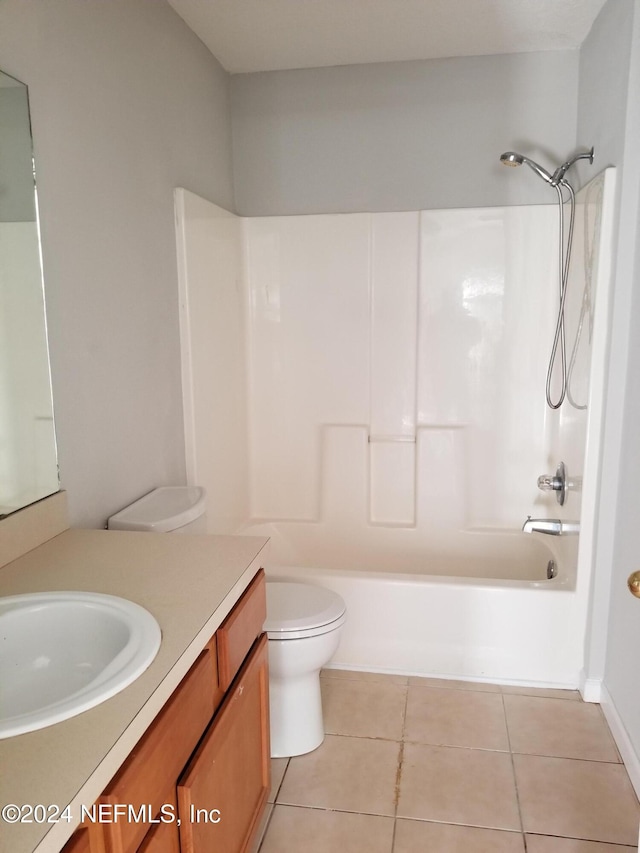 full bathroom with shower / bathing tub combination, vanity, toilet, and tile patterned floors