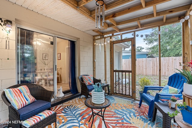 sunroom with a wealth of natural light and ceiling fan