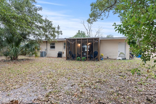 back of house with a sunroom and cooling unit