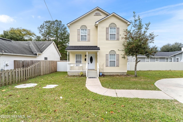 front of property with a porch and a front yard