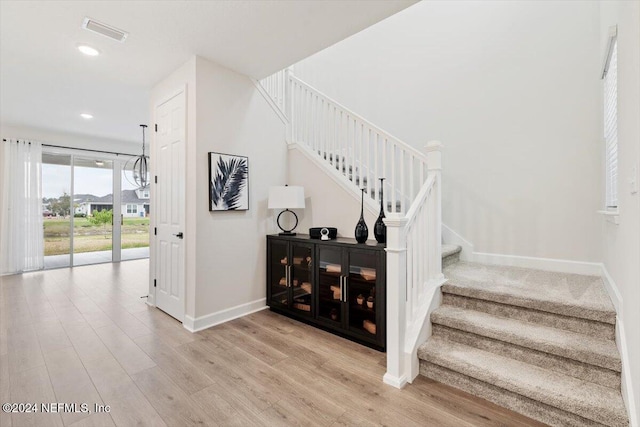 stairway featuring wood-type flooring