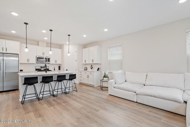 living room with light hardwood / wood-style floors