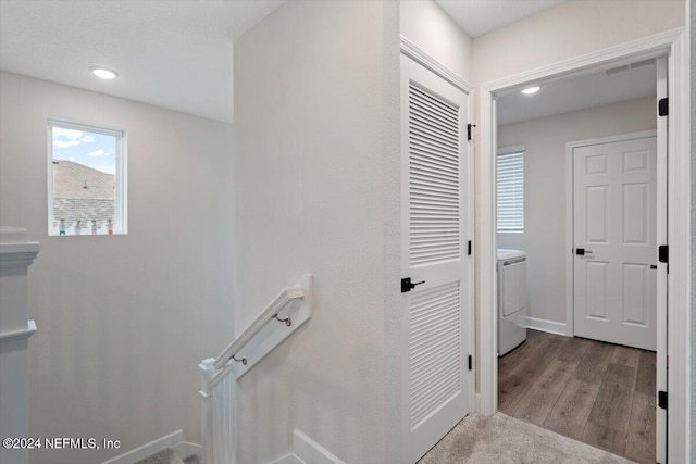 stairway with hardwood / wood-style flooring