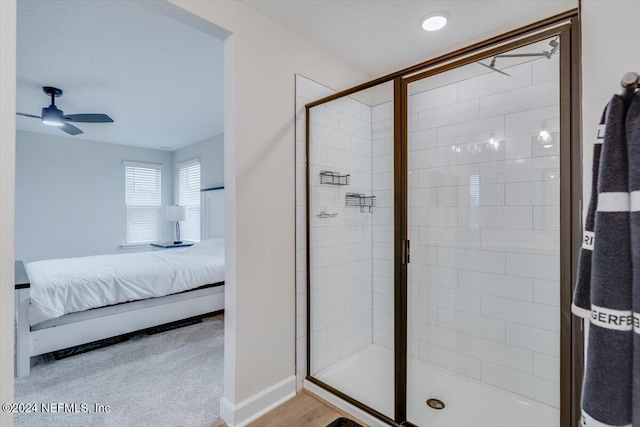 bathroom featuring walk in shower and ceiling fan