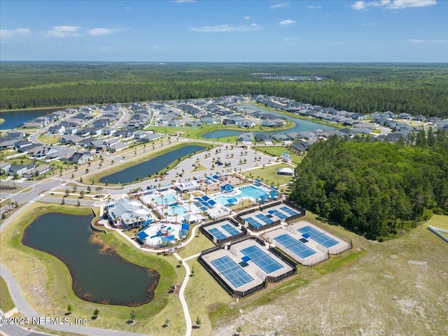 birds eye view of property with a water view