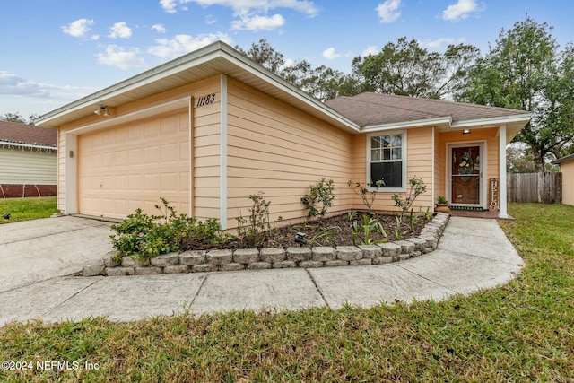 ranch-style home with a garage