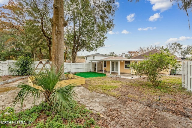 back of property with a patio area