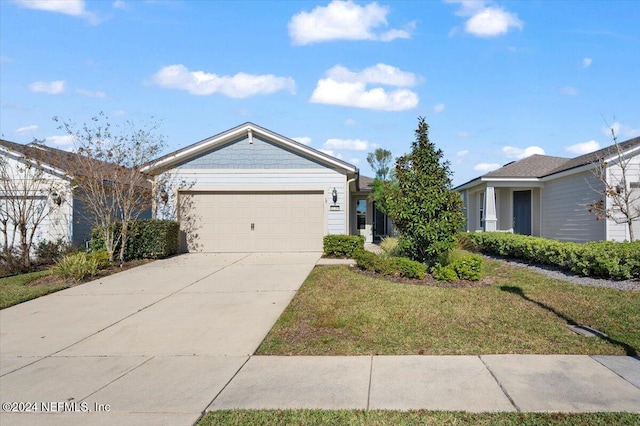 ranch-style house with a garage and a front lawn