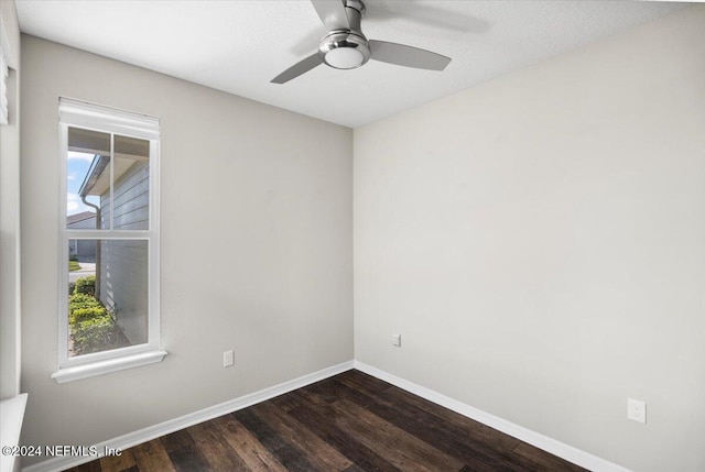 unfurnished room featuring dark hardwood / wood-style flooring and ceiling fan