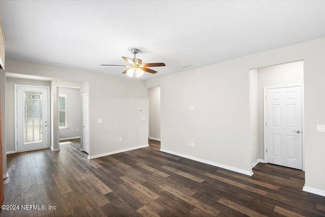 empty room featuring dark hardwood / wood-style floors and ceiling fan