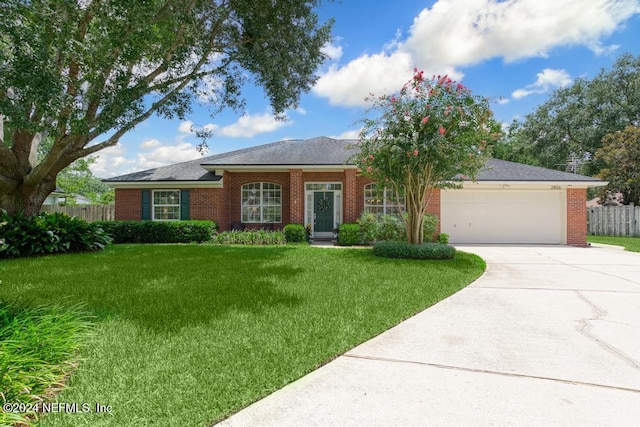 ranch-style house featuring a front lawn and a garage