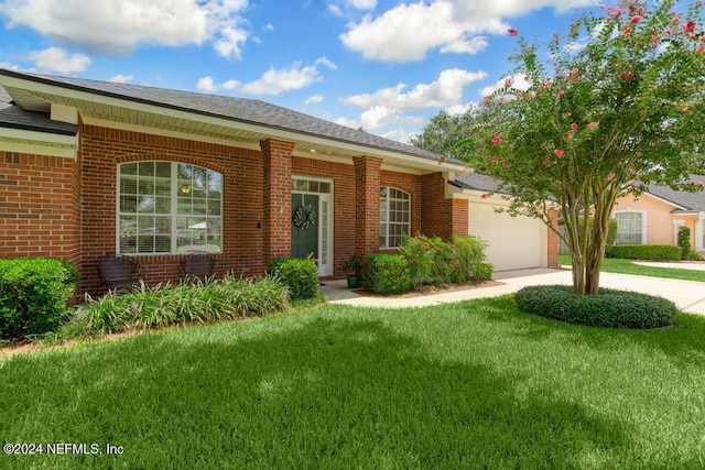 single story home featuring a front yard and a garage