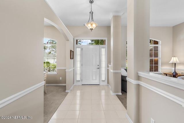 entryway featuring light colored carpet