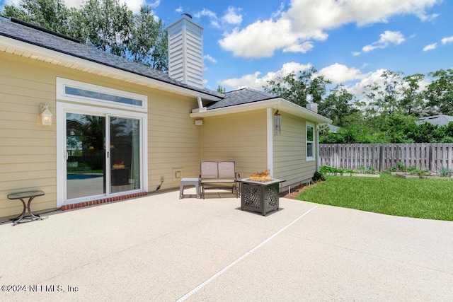 view of patio with a fire pit