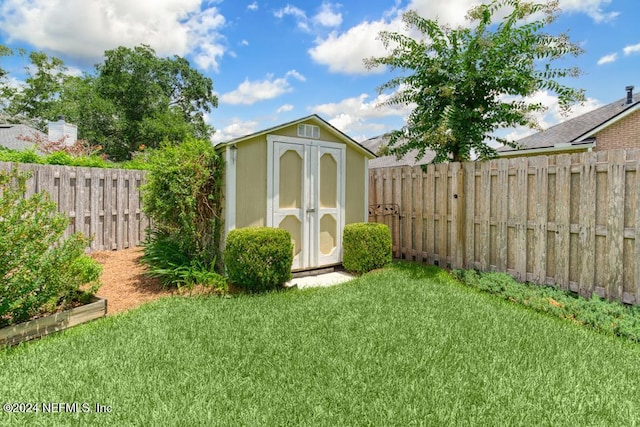 view of outbuilding featuring a lawn