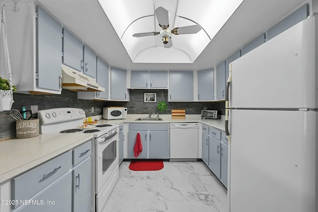 kitchen with decorative backsplash, ceiling fan, sink, and white appliances