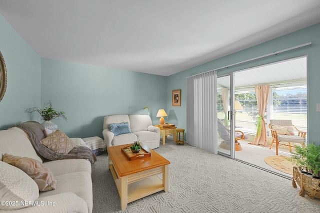 living room featuring light colored carpet