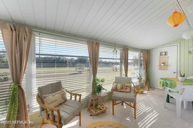 sunroom featuring lofted ceiling