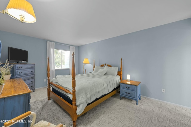 bedroom featuring light colored carpet