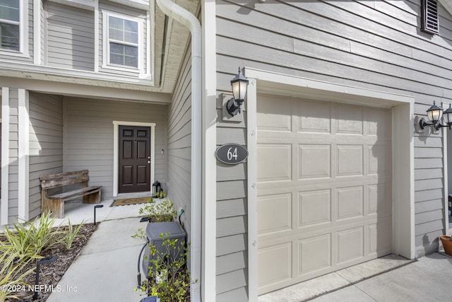 property entrance with a garage