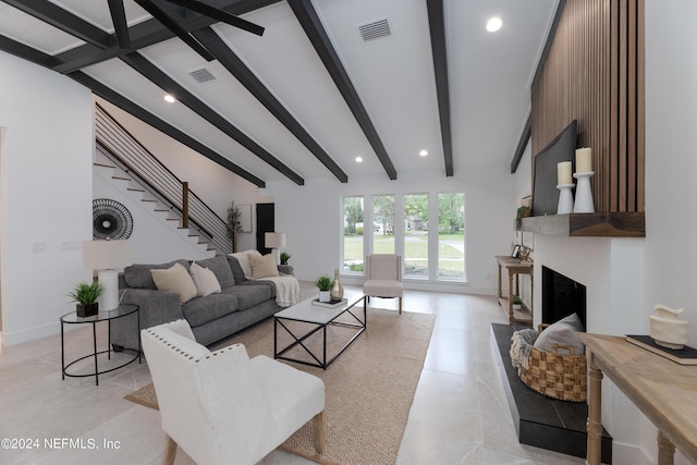 living room featuring vaulted ceiling with beams