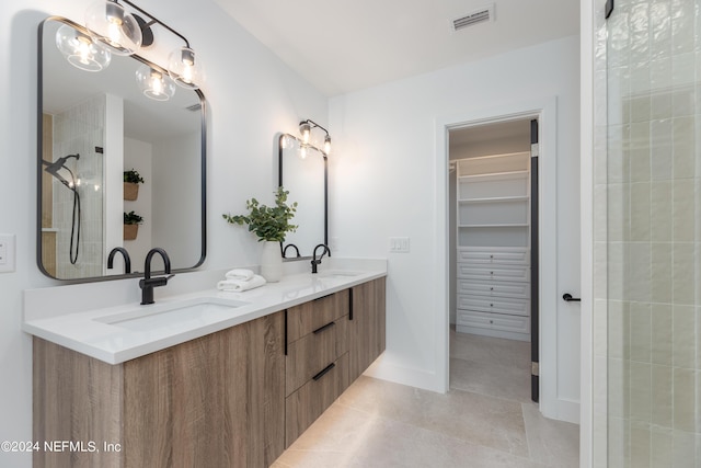 bathroom featuring tile patterned floors and vanity