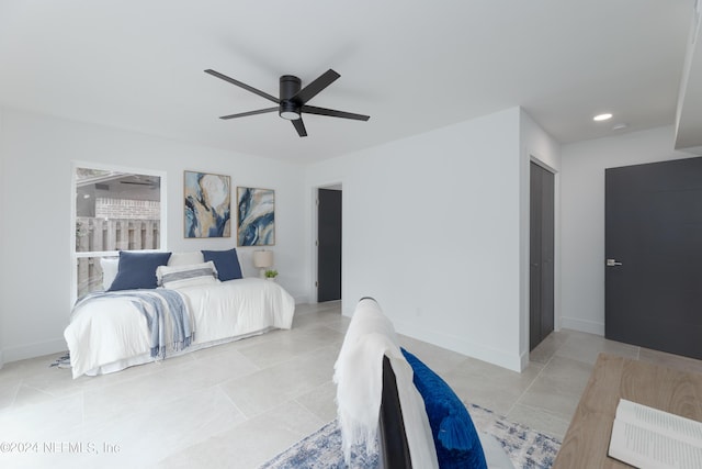 bedroom featuring light tile patterned floors and ceiling fan