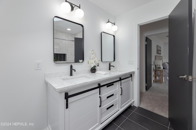 bathroom featuring tile patterned flooring and vanity