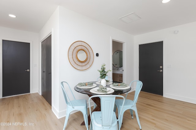 dining area with light hardwood / wood-style flooring