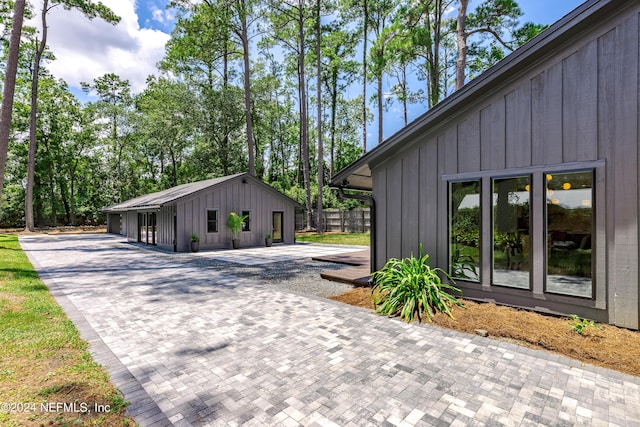 view of home's exterior with an outbuilding and a garage