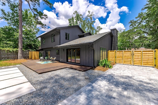 rear view of house with a deck