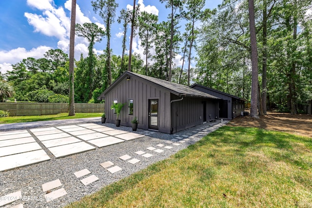 exterior space featuring a lawn and a patio area