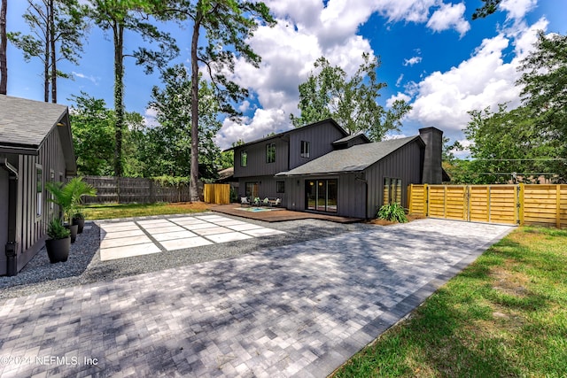 exterior space with a patio and a deck