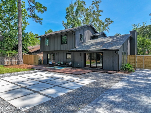 rear view of property with a patio area