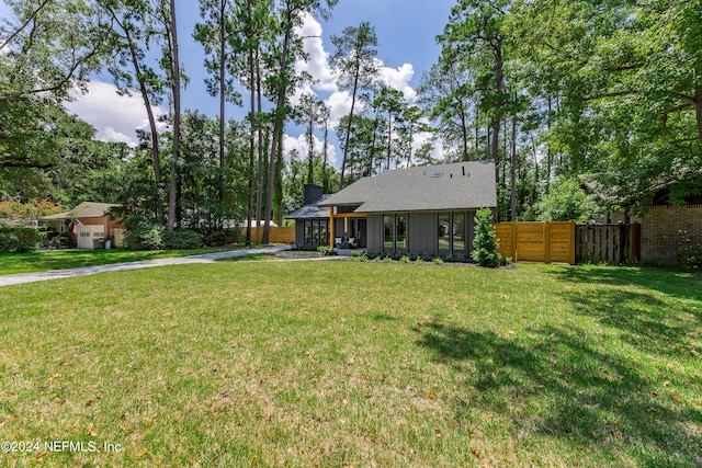 view of yard featuring a sunroom