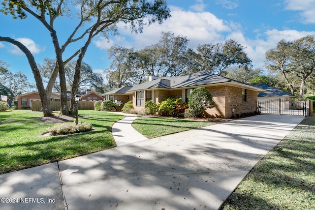 ranch-style home featuring a front lawn