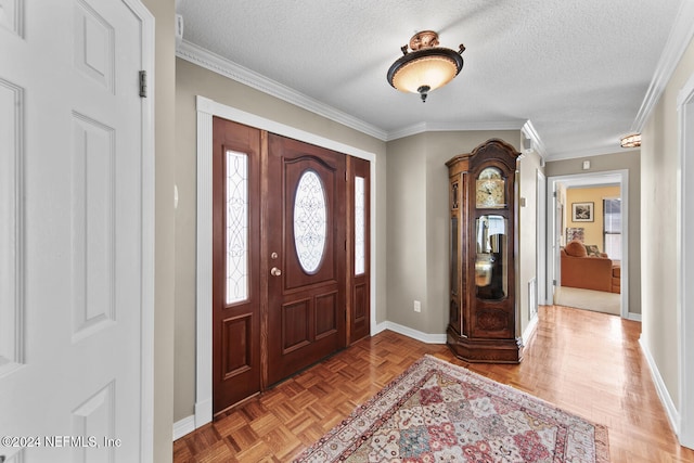 entrance foyer with a textured ceiling, light parquet flooring, and crown molding