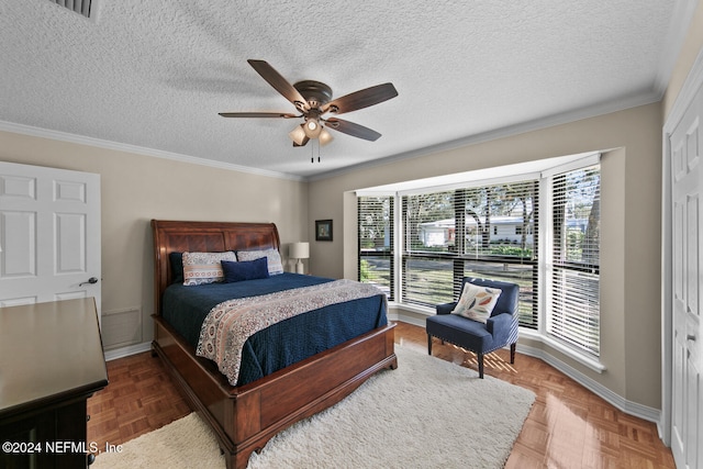 bedroom featuring a closet, ceiling fan, and crown molding