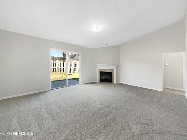 unfurnished living room featuring carpet flooring