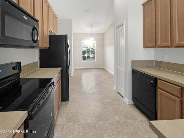 kitchen featuring hanging light fixtures and black appliances