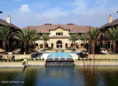 back of house featuring a water view