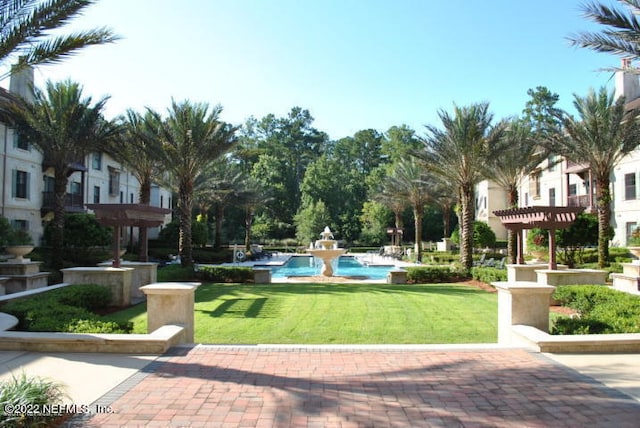 view of home's community with a lawn