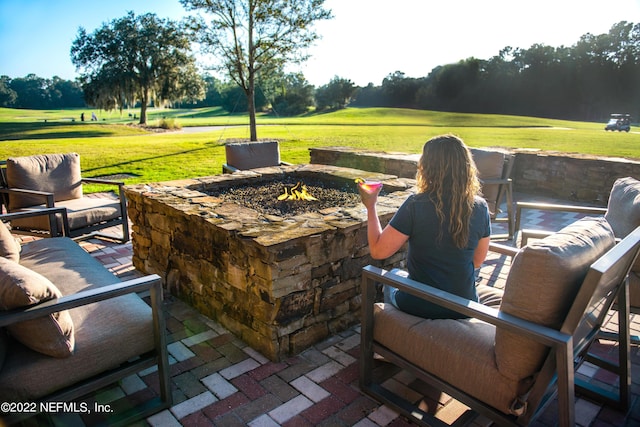 view of patio / terrace with a fire pit