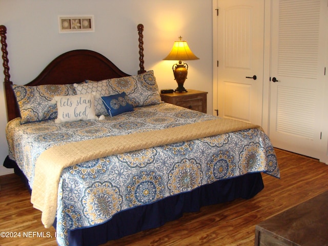 bedroom featuring a closet and wood-type flooring